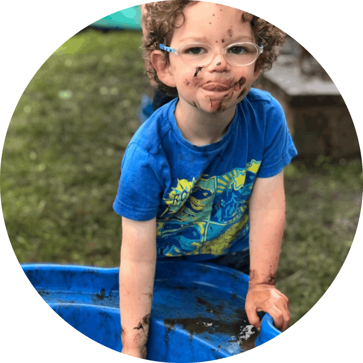 child playing in mud